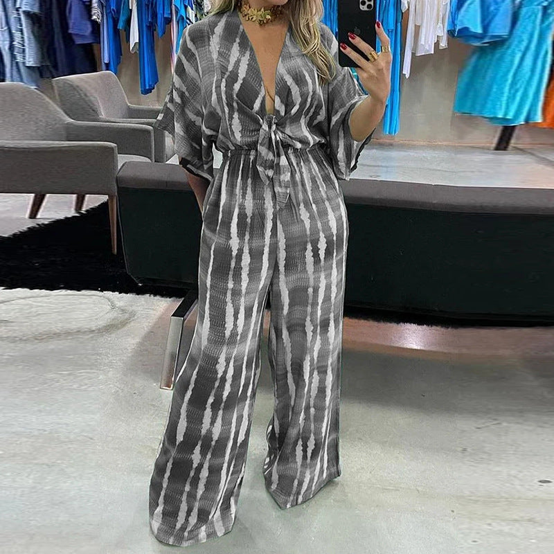 Naisten leveästi leikattu jumpsuit tyylikkäällä solmulla ja elegantilla hihalla Luvik
