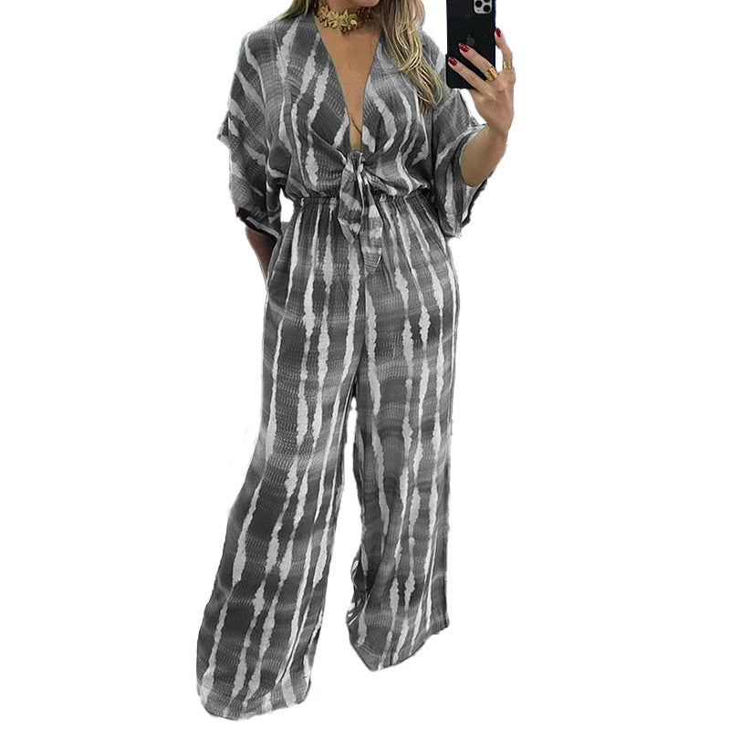 Naisten leveästi leikattu jumpsuit tyylikkäällä solmulla ja elegantilla hihalla Luvik