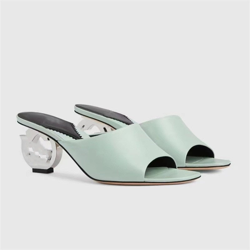 Femme Open-Toe Mules, joissa on veistoksellinen korkosuunnittelu Luvik