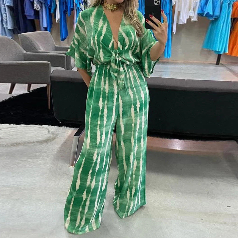 Naisten leveästi leikattu jumpsuit tyylikkäällä solmulla ja elegantilla hihalla Luvik